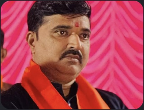 Hardikbhai Tamaliya in saffron scarf