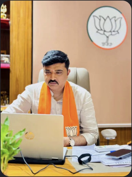 Hardikbhai Tamaliya working at a desk