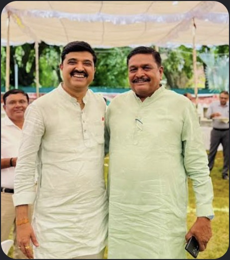 Hardikbhai Tamaliya outdoors with leader
