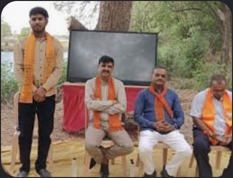 Hardikbhai Tamaliya with local workers outdoors